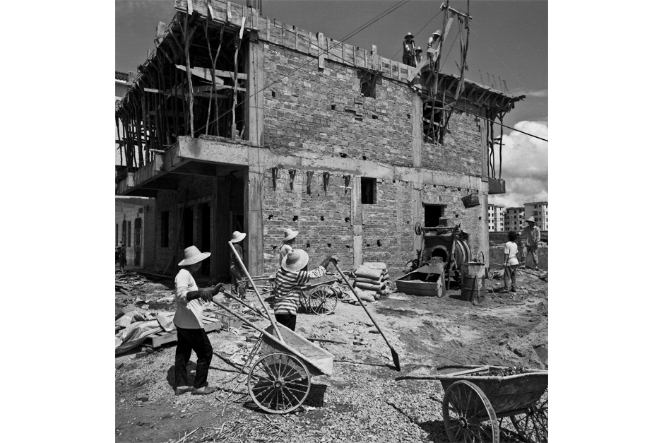 Communal home construction for workers outside a factory in Kengzi, Guangdong province, 1999.