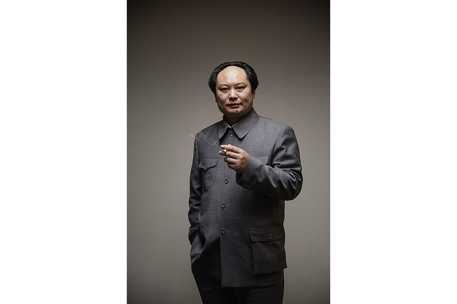 Mao impersonator Yang Chunlong poses for the photographer before a performance in Beijing. Photo by Matjaž Tančič @matjaztancic