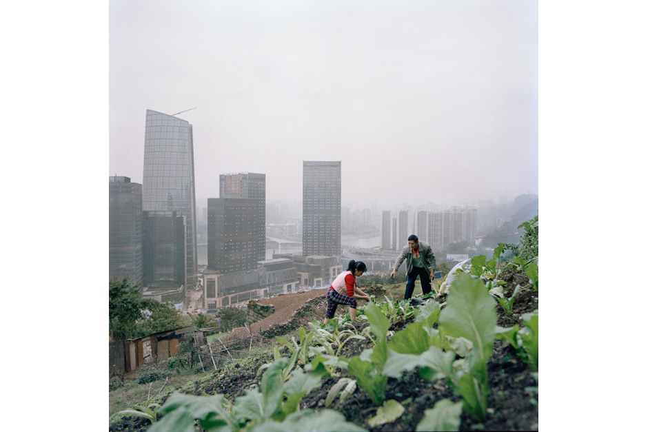 Huang Chunying and her husband work barefoot on a garden above the new business developments in the Tiandi district. Across the river from Jiangbei, a Hong Kong property developer is putting the finishing touches on a sleek modern development. There, residents and visitors who make up the emerging upper-middle class will be offered every modern-day convenience.