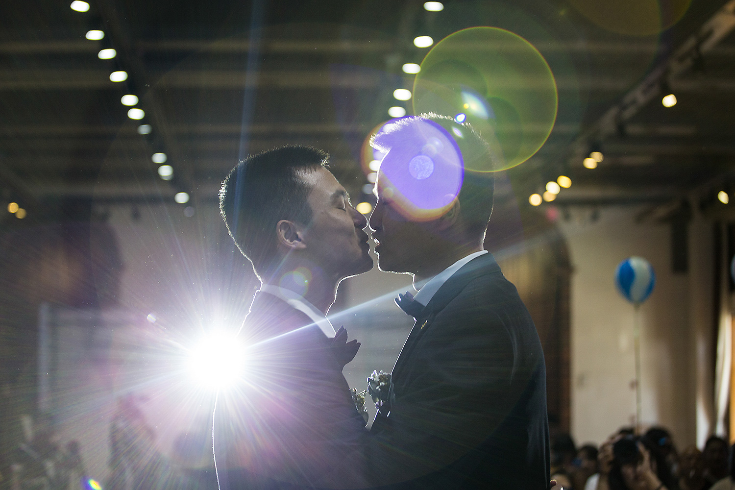 Sun Wenlin and Hu Mingliang kiss during their illegal wedding ceremony in Changsha, Hunan province. Photo by Wu Yue @yuewoo