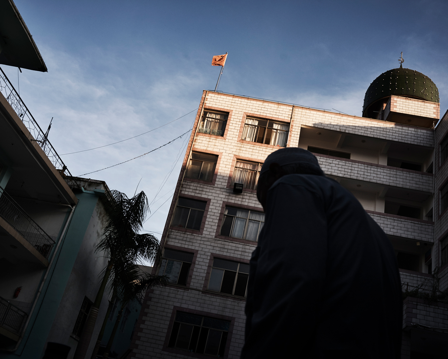 A People’s Republic of China (P.R.C.) flag flies over Nanguan Mosque, in the city of Kaiyuan, China’s southwestern Yunnan province, June 2016. Last year, state-sanctioned religious associations proposed that all religious venues in China should raise the P.R.C. flag.
