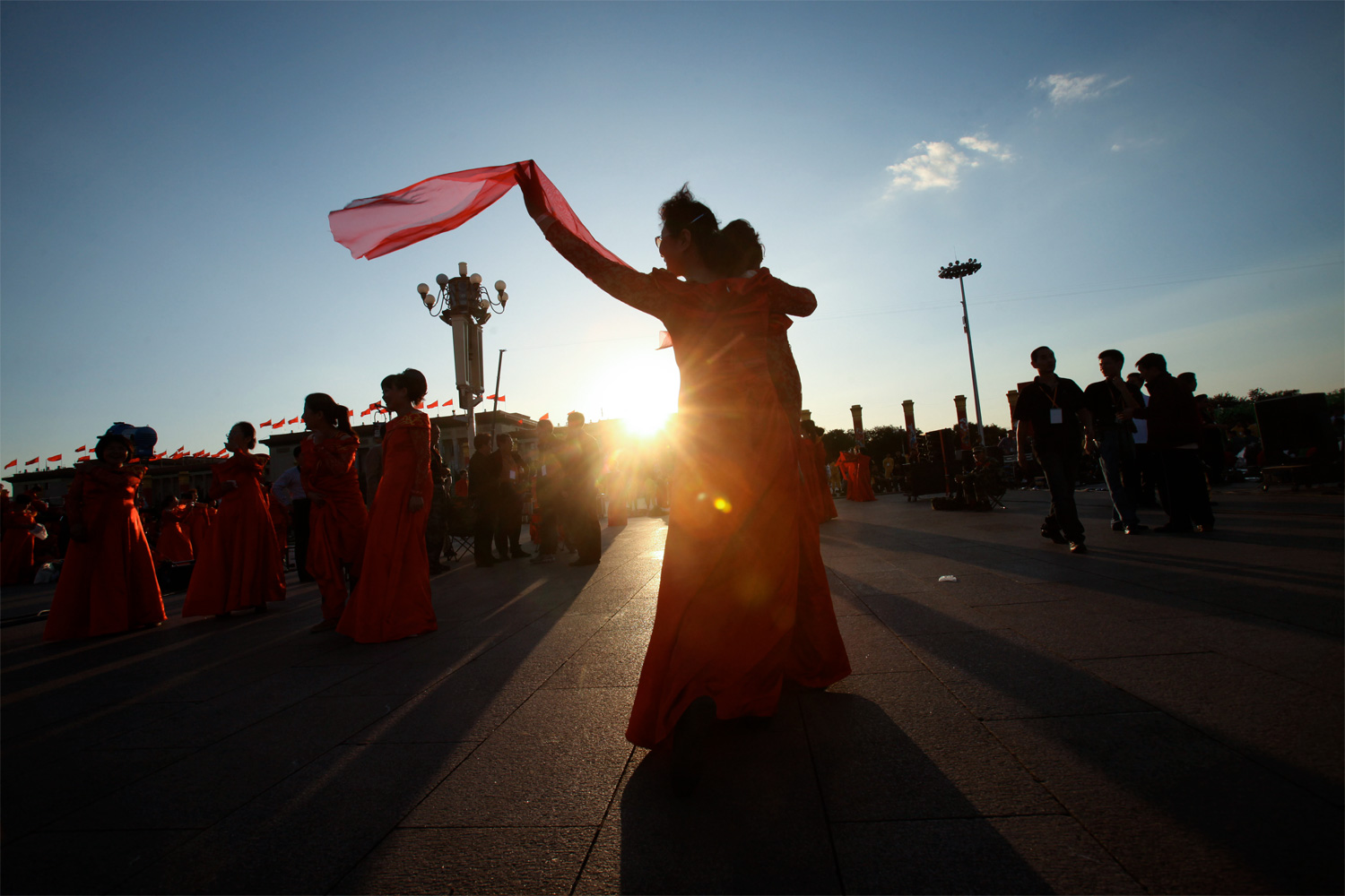 A group of female performers rehearse a routine one last time at sunset on National Day, October 1, 2009 in Tiananmen Square. National Day marks the founding of the People’s Republic of China.