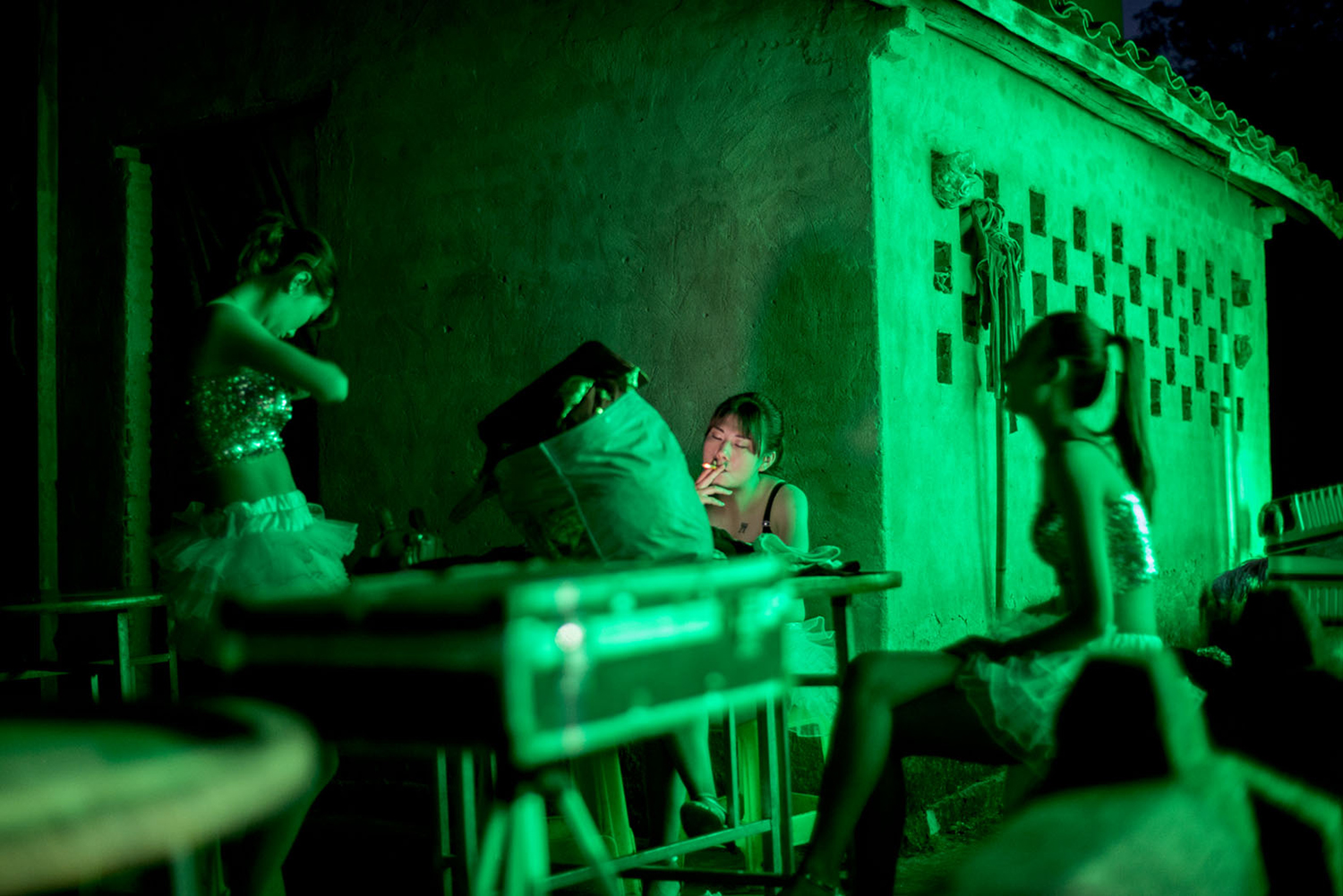 Dancers wait backstage at a funeral performance, May 26, 2016.