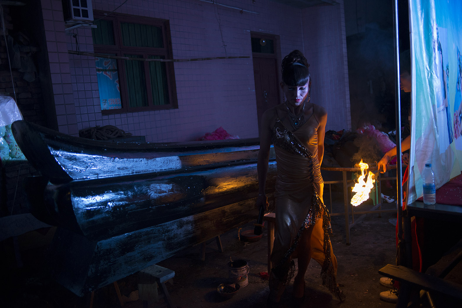 Liangzi walks in front of a coffin, October 28, 2014.