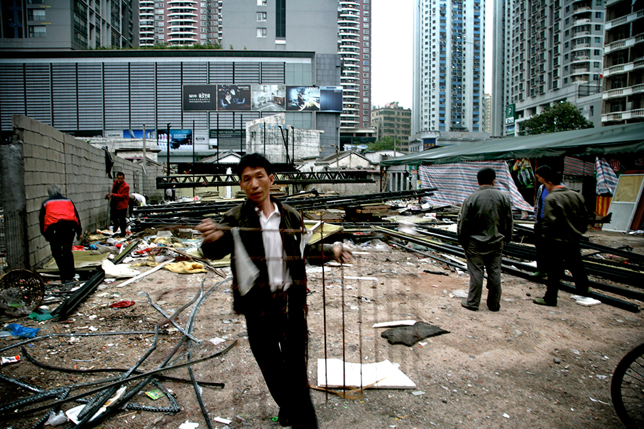 In the late 1990s, Shenzhen embarked on plans for an ambitious new civic center and a central business district master plan. As the plan moved forward, Gangxia West Village was the last urban village left standing within the planning boundary of the Shenzhen Central Business District. Following demolition, workers would scour the area for recyclables and salvageable materials.