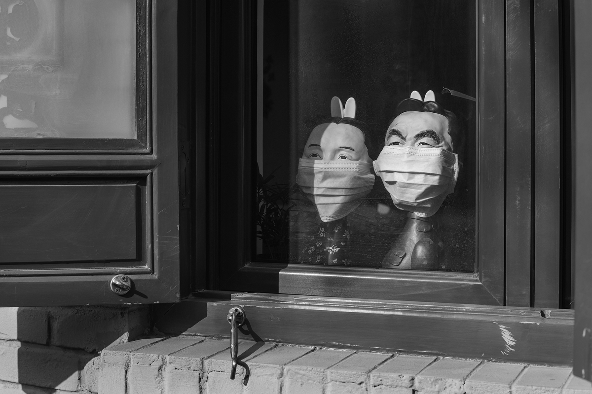 Statues of rabbit gods, Beijing folklore deities, dressed with masks inside a window in Mao’er Hutong on Nanluoguxiang, January 29, 2020.
