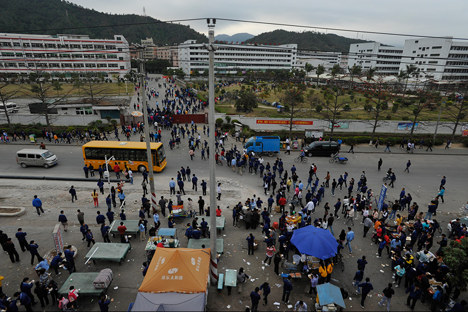 A little after 7 a.m., some of the 18,000 employees arrive for work at the Taiwan-owned Freetrend plant in Longgang. It is the largest manufacturer of New Balance products in the world.