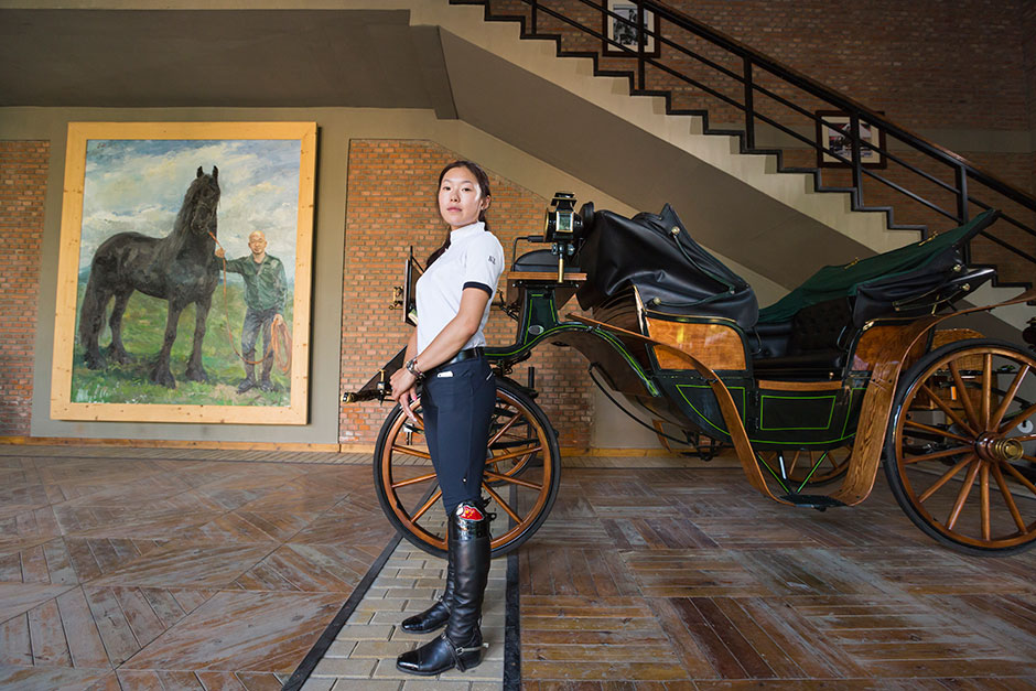 Tian poses at the entrance of P.Y. Fulisilan Equestrian Club.