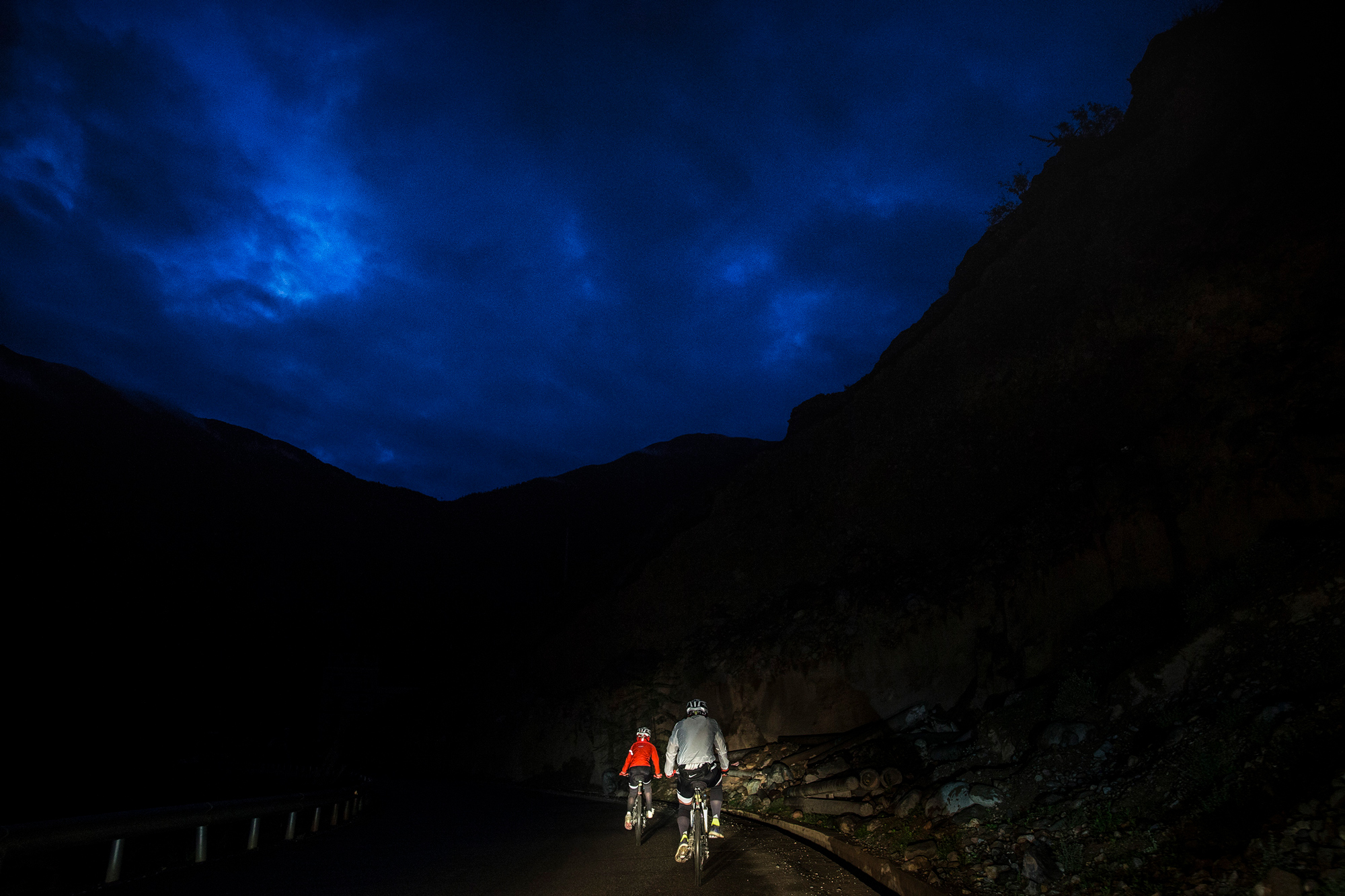 In order to cross a bridge which will be closed later in the day, Chao and Runxi get up at 5:00 a.m. to start the day’s ride, in Rumei township, Qamdo, Tibet, July 26.