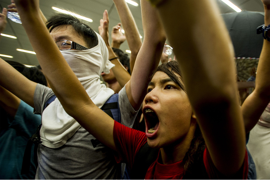 Pro-democracy protesters shout slogans during a demonstration at Hong Kong government headquarters. (Photo by Xaume Olleros/AFP/Getty Images)