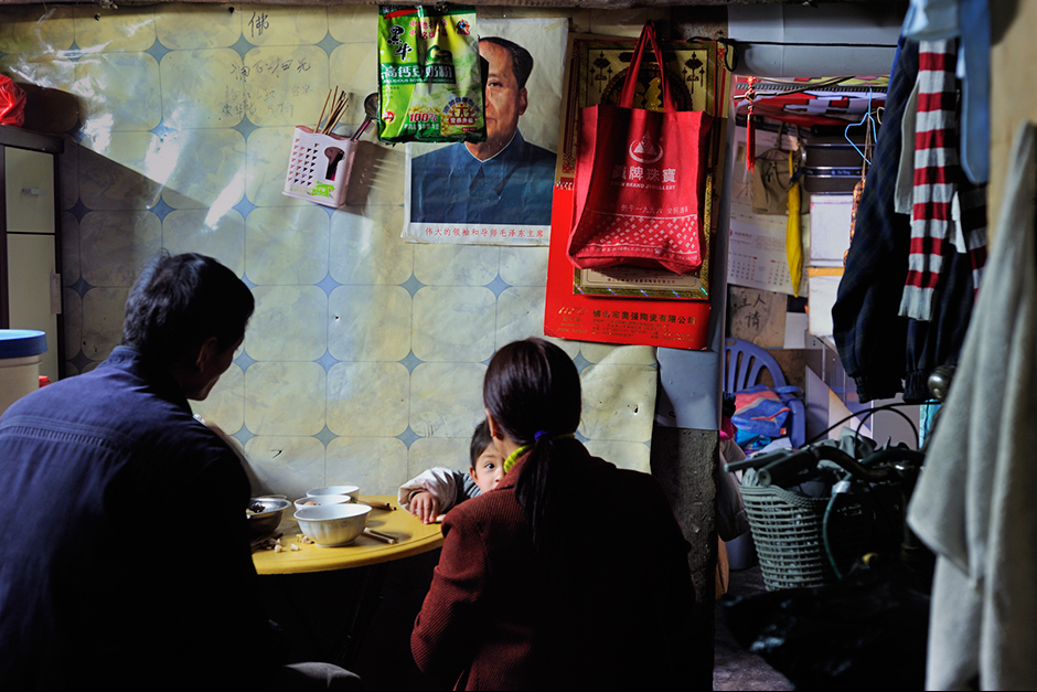 A family eats in their twenty-five-square-meter home.