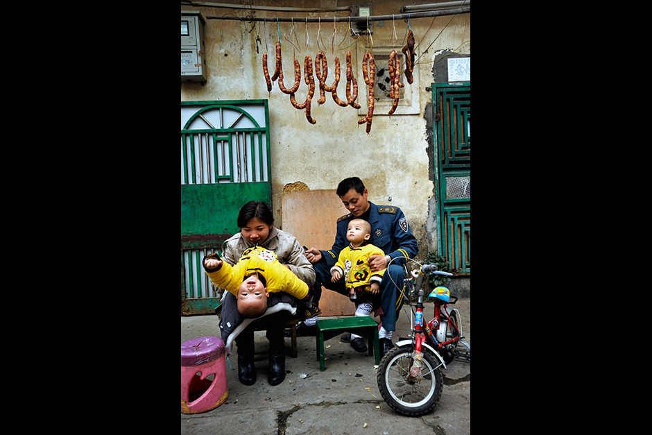A couple who upgraded to a nearby apartment after having twins return to Wuwucun for a visit. The village homes are tiny—about 270 square feet—and typically house four people. Rent is 150 yuan ($24) a month, about half that of an apartment. Villagers who talk of going back to Chongqing say that it’s mainly because education and housing are pricey in Shenzhen.