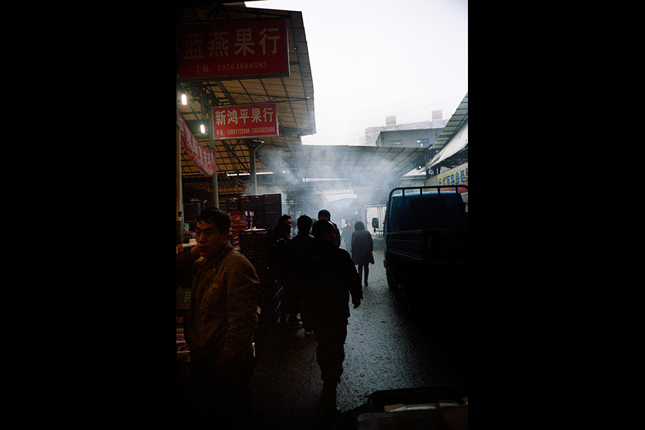 The Tongchuan Road Wholesale Fruit Market in Shanghai’s Putuo District is busy with activity during an evening in January 2010. The land of the market is collectively owned by the former farmers of the village that previously occupied the site.