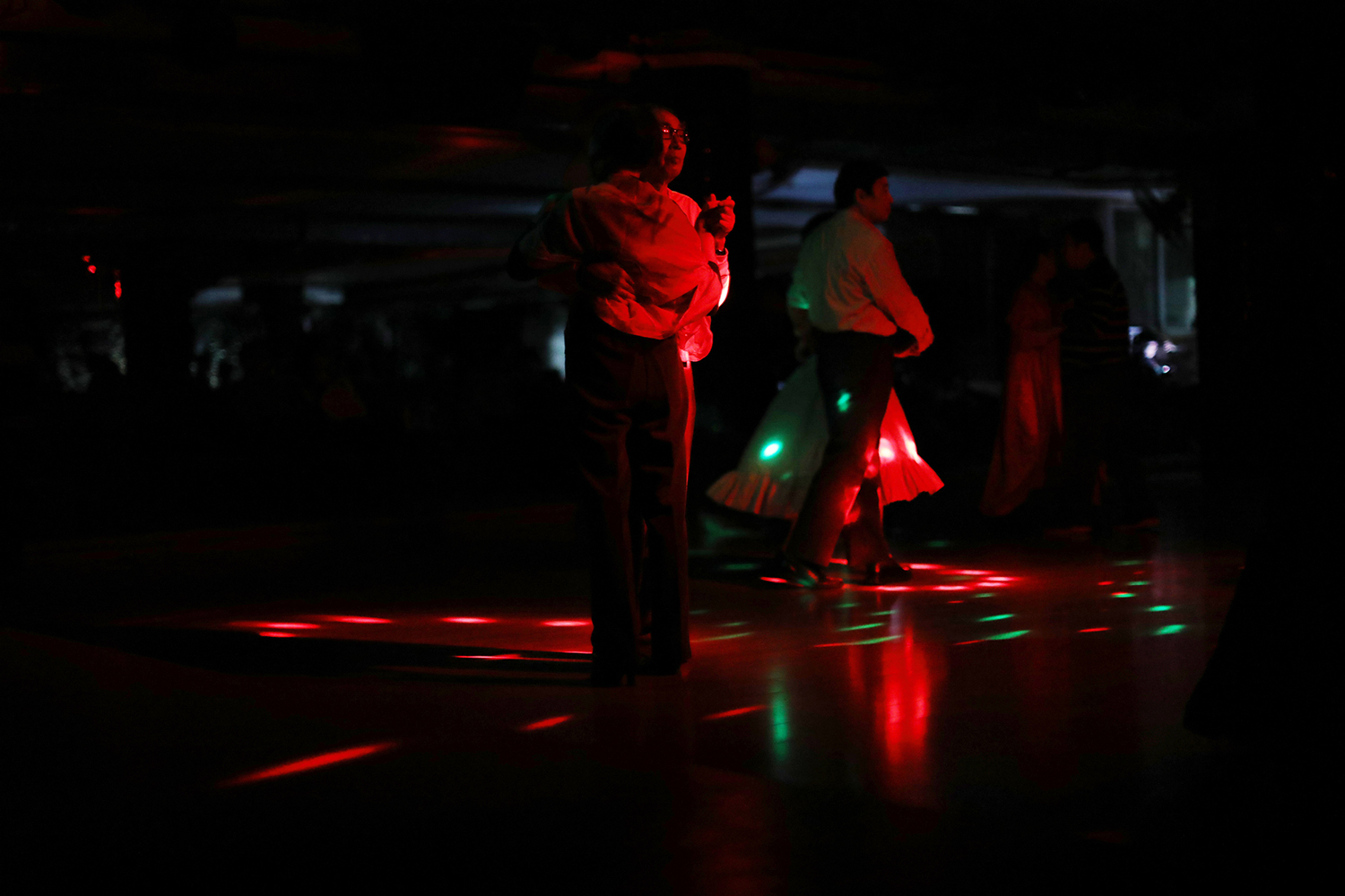October 22, a man in his 70s dances at a club for middle-aged and elderly people in Hangzhou, Zhejiang province. China’s One Child Policy has left the country with an aging crisis—almost a quarter of the country will be over 65 by 2050—and new businesses targeting elderly customers are beginning to emerge. (Liu Feiyue)