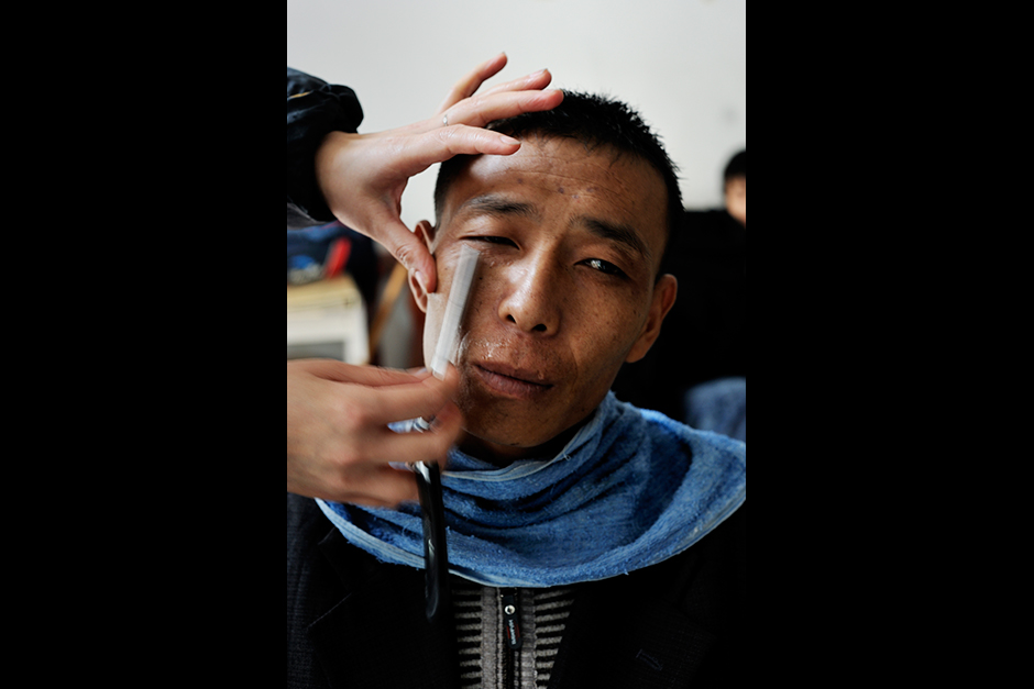Cutting anything during the Spring Festival is considered unlucky, so a Wuwucun man gets a shave and a haircut a couple of days before.