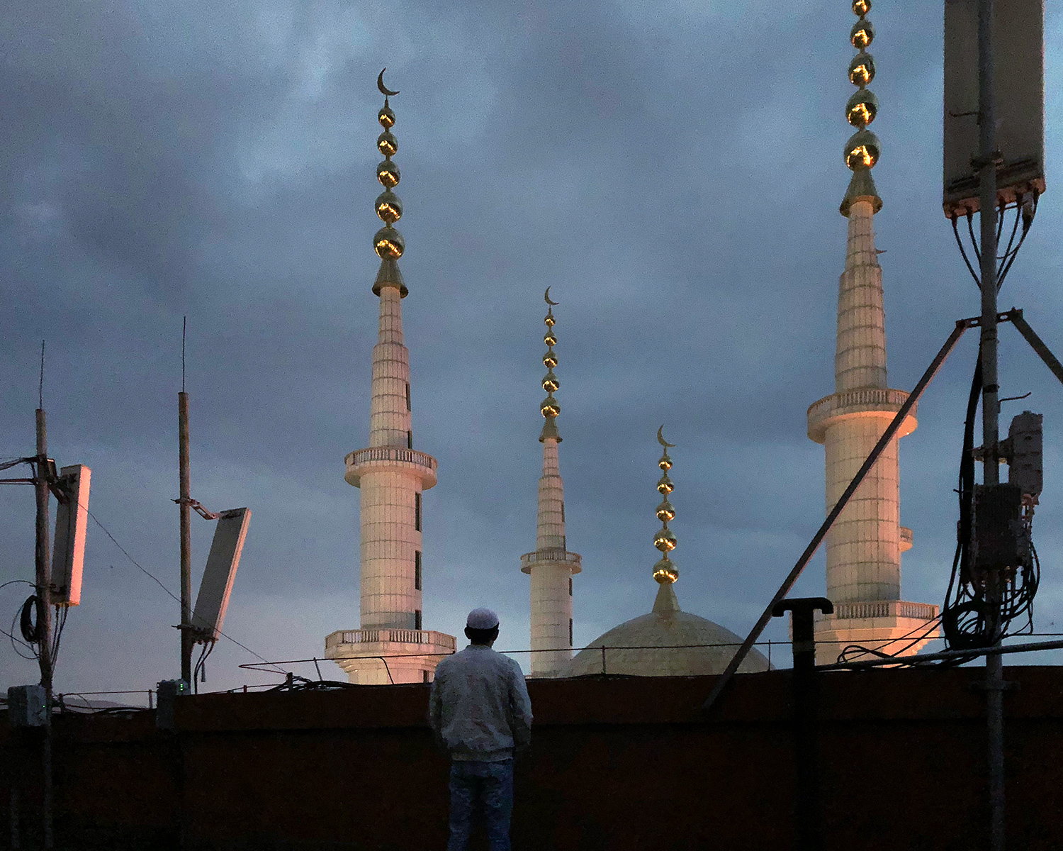Kashim, Mohammed’s younger brother, looks out over his hometown, in Guanghe, Gansu province, September 2018. He was born in 1992 and attended the University of Jordan from 2013 until he graduated in 2018. He and Umar met during school and became friends. Guanghe county has a large Muslim population, and its residents have encountered increased restrictions on religious practice in recent years.