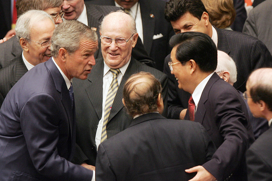U.S. President George W. Bush greets Algerian President Abdelaziz Bouteflika, center, and Chinese President Hu Jintao during the Security Council meeting on September 14, 2005, at the 60th session of the United Nations General Assembly in New York. (Photo by Jim Watson/AFP/Getty Images)