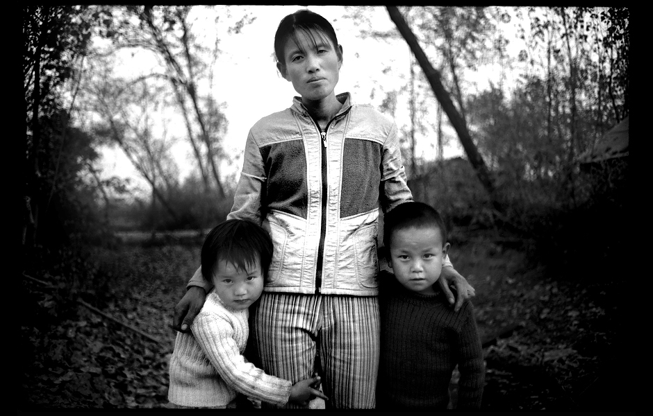 After her husband’s funeral, Mrs. Wang stands with her children. At age 34, Mr. Wang died of liver cancer caused by hepatitis B—one of approximately 250,000 Chinese killed every year from hepatitis B-associated liver cancer and cirrhosis. Henan, China