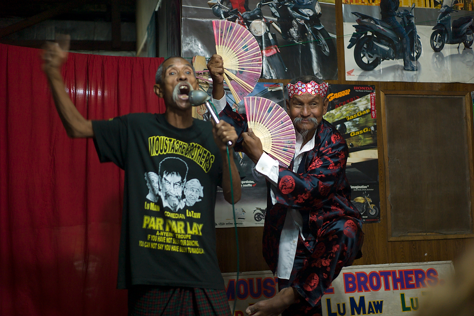 The Moustache Brothers perform their famed and blacklisted comedy act, which makes China as well as the Burmese government the butt of many jokes. As performer Par Par Lay, right, does a mock Chinese dance, his younger brother Lu Maw, left, says: “Burma is very lucky to have China as a neighbor. We can have Adidas, Nike. Only three dollars. All fake.”