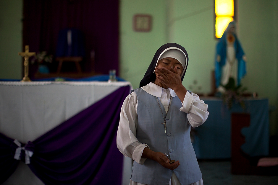 Sister Elizabeth Lydia, who lives in an old church near the controversial hydroelectric project, sobs as she speaks of her parishioners in the village of Tang Phare. The villagers have been forced to relocate because of the dam project, though the church and its clergy have, for now, been allowed to stay on in the area without their congregation. Sister Lydia was detained by the authorities as she attempted to build a flood wall around the church.