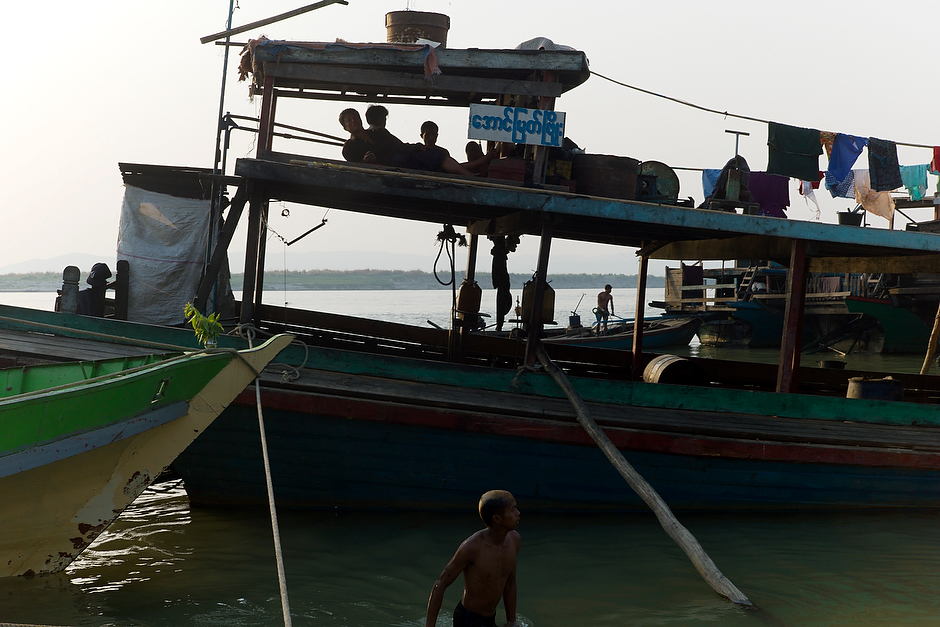 An evening river scene at the docks of the Mandalay jetty, along the Irrawaddy River.