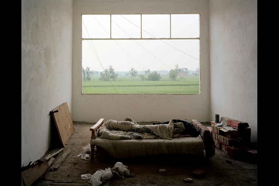 A temporary bedroom in a newly constructed village house in rural Chongqing.