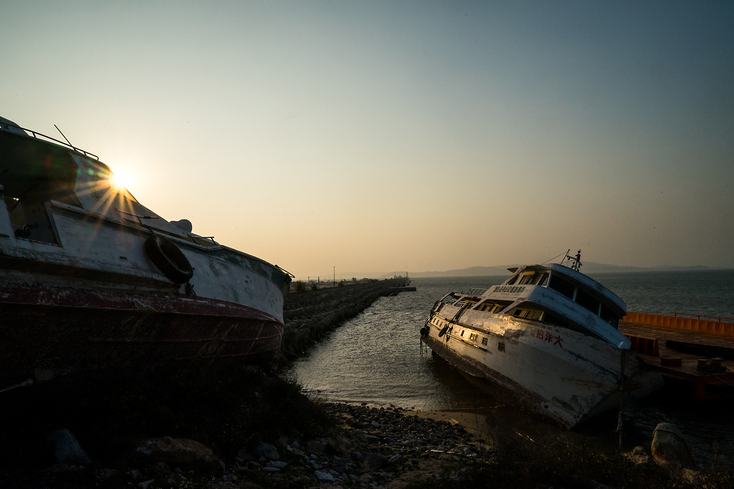 In the former fishing village of Houfenggang, the reclamation of land and development of an embankment and new port swept away the natural port and with it the livelihoods of the fishermen. Some of their ships and boats are left rotting, disused, near the new concrete embankment. Development by the government—with one eye on attracting ever more mainland Chinese tourists—has emerged as the key issue Kinmen’s burgeoning civil society activism centers on.