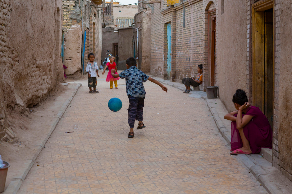 An alleyway in the old part of Kashgar, where soccer is one of the abiding passions of the city’s youth.