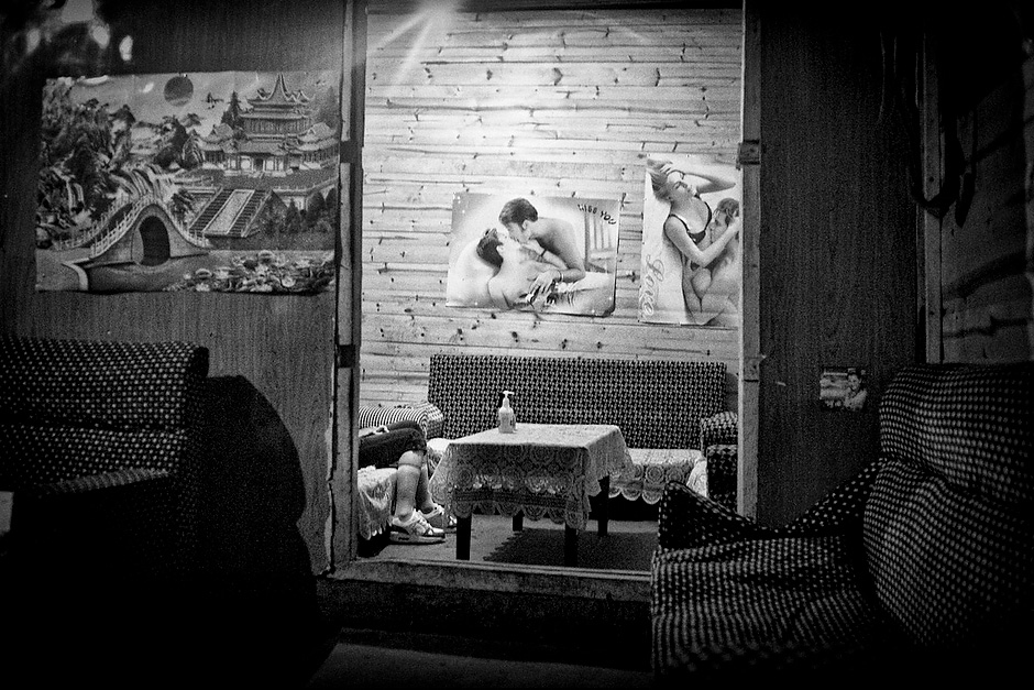 With electricity came nightlife: bars sprang up around the hot spring soon after the village joined the power grid in 2000. They have since become a place for boys to meet girls and for outsiders to get drunk and rowdy. Aguwa, Yunnan, China.