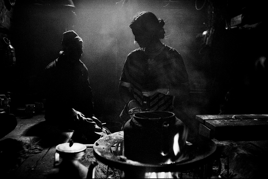 The Mosuo household thrives on numbers, and this one in Wujiu has thirty members. However the young and able-bodied are either seeking higher education or employment in cities, leaving only ten of their relatives behind. Still, the family is rich by local standards: they own thirty yaks, thirteen pigs, and sixty goats. With income from these animals, the family built a new two-story prayer hall. Wujiu, Sichuan, China.