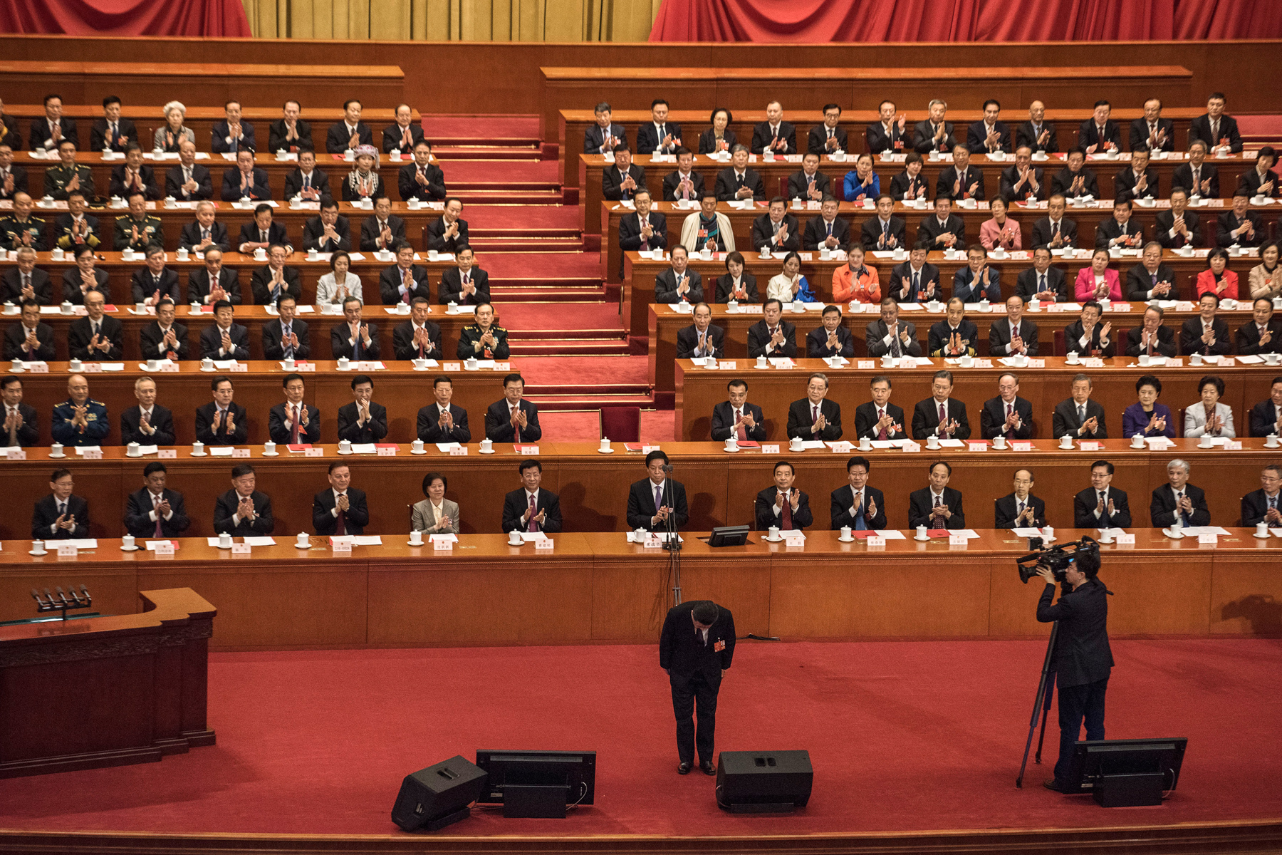 China’s President Xi Jinping bows before his speech during the closing session of the National People’s Congress at the Great Hall of the People in Beijing, March 20. Legislators passed an amendment to abolish the two-term limit of the presidency, opening the door for Xi, who is also General Secretary of China’s Communist Party, to rule in perpetuity. (Kevin Frayer/Getty Images)