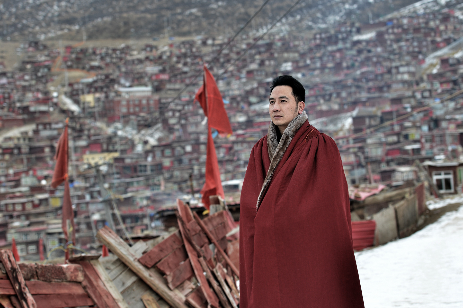 Lin Shengbin, whose wife and children died in an arson attack, takes a walk at the Larung Gar Buddhist Academy, in Sertar county, Tibet Autonomous Region, January 6. In June 2017, Lin’s nanny, Mo Huanjing, deep in gambling debt, made a plan to set fire to her employer’s home and then extinguish it, hoping the family would reward her financially. The fire killed Lin’s three children and wife. Mo was sentenced to death and Lin, tormented by his loss, converted to Buddhism. (Li Qizheng/Sina) 