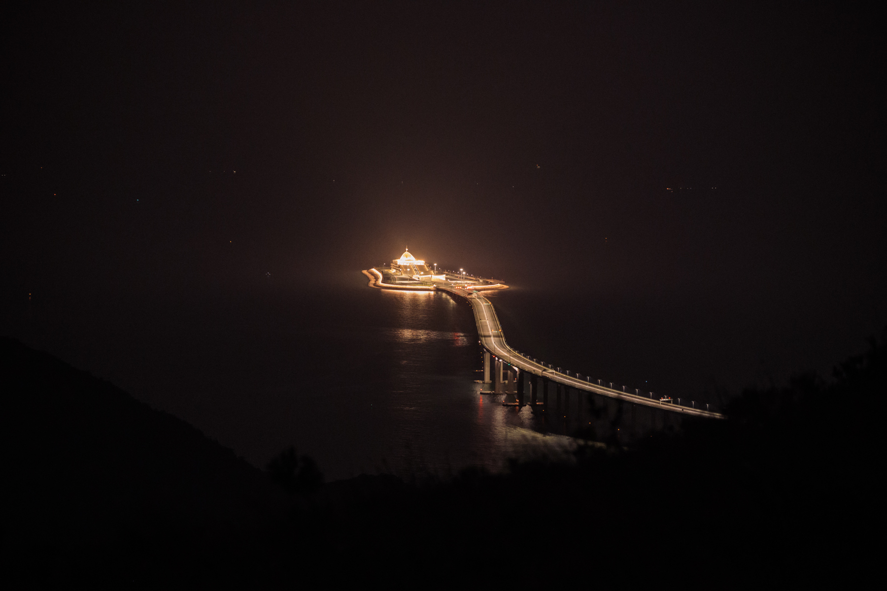 An evening view of the Hong Kong-Zhuhai-Macau bridge and its entrance to a cross-sea tunnel in Hong Kong, October 3. The world’s longest sea bridge, it opened in October and spans 34 miles (55 kilometers), linking Hong Kong and Macau to the cities of the Pearl River Delta. The $20 billion bridge is an element in the Greater Bay Area plan, a government initiative to form a high-tech zone that ties Hong Kong and Macau to China’s southeast coast. (Billy H.C. Kwok/Getty Images)