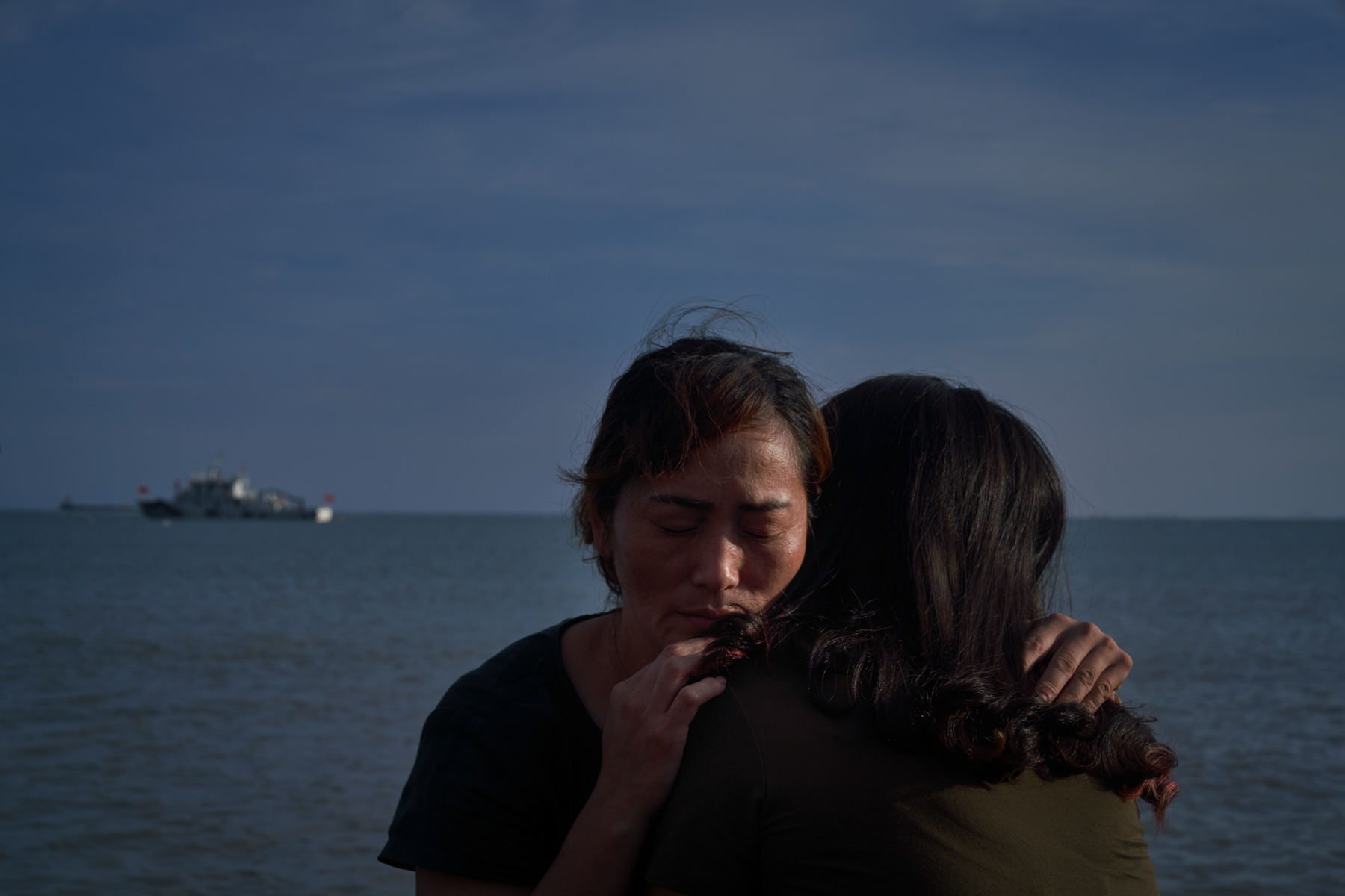 Two women abandoned as infants hug each other, in Putian, Fujian province, June 9. Since the 1960s, thousands of infant girls have been sold from Changle to Putian, a wealthier part of Fujian 60 miles away. Some raised these girls as their own, but others treated them like maids, or “tongyangxi,” pre-adolescent daughters raised to be married to their “brothers.” The centuries-old practice was revived between the late 1970s and 2016, when China’s one-child policy was in effect. (Liang Yingfei/Ciaxin)
