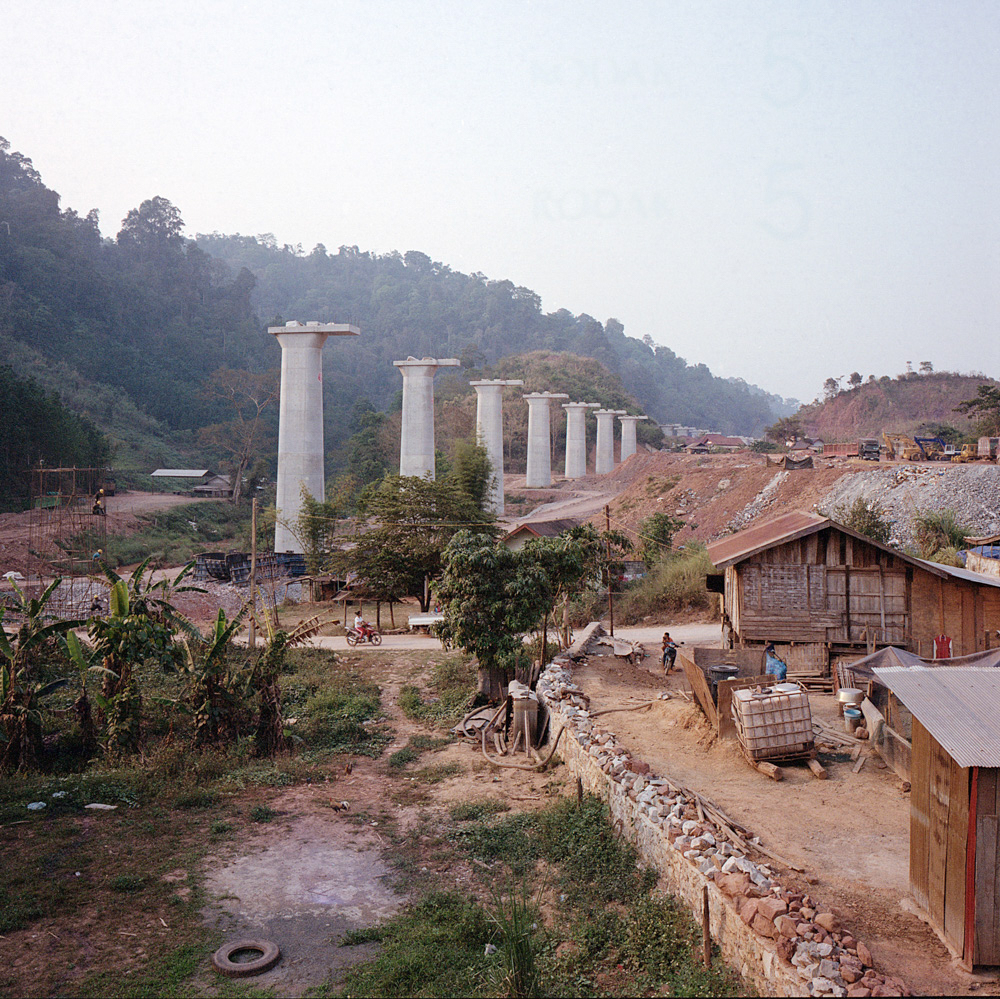Columns for the new high-speed railway line tower over the village of New Boten in Laos near the border with China, April 10, 2019. The Chinese-built railway will connect China to Laos.