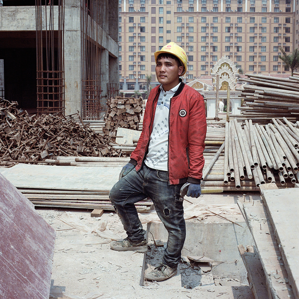 San Phanthanith moved from a nearby village to work on a Chinese-run construction site in Boten, April 14, 2019. He earns more money now than at his previous job on a banana plantation.