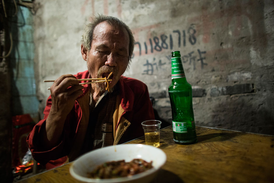 <em>Dou gan</em>, a dish of fried noodles with peanuts and spices, is a popular dish at this small unnamed outdoor noodle cafe at the bottom of Shibati, or “18 Steps,” in central Chongqing. This neighborhood dates back to the Ming Dynasty when 18 steps took residents down to a freshwater well.
