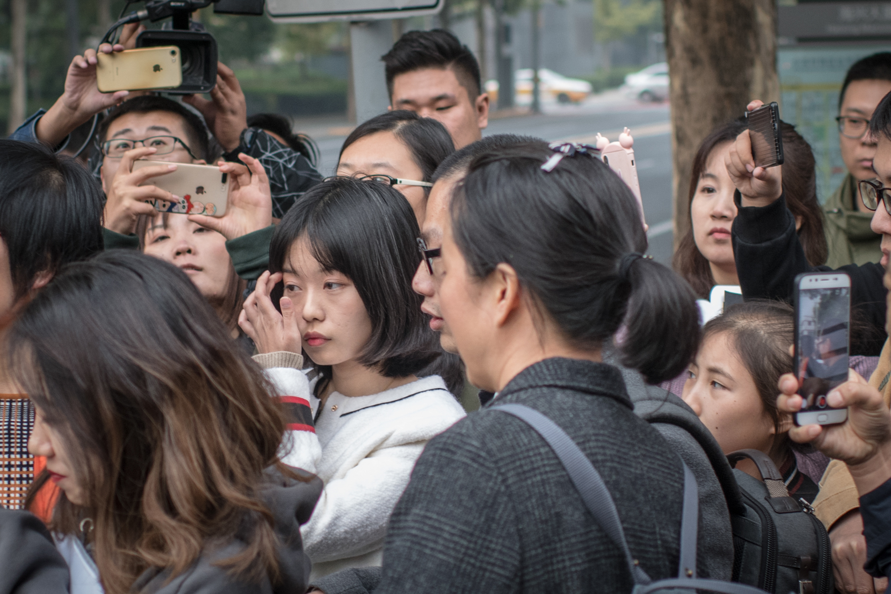 Zhou Xiaoxuan, who accused prominent TV host Zhu Jun of sexual assault, leaves court after a pretrial evidence exchange hearing in the suit Zhu filed against her for defamation, in Beijing, October 25, 2018. In July, Zhou disclosed on her WeChat account that Zhu had groped and forcibly kissed her four years earlier when she was an intern at his television station. Her post went viral.