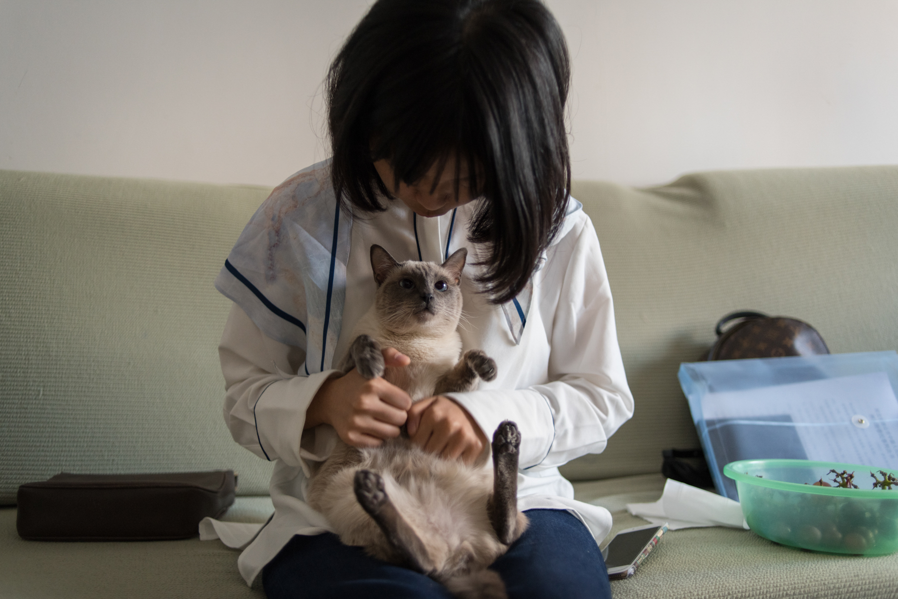 Zhou with her cat, October 9. Zhou says she used to ask for love from her boyfriend, her family, and her friends, but in her relationships with other victims, she has gradually learned how to give love. “For example, when you comfort someone, even though she may only feel relieved for five minutes and then fall back to sadness the next day, that five minutes is still meaningful.”